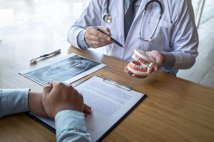 hereth insurance consulting - is dental insurance worth it - Dentist Explaining Dental Treatment