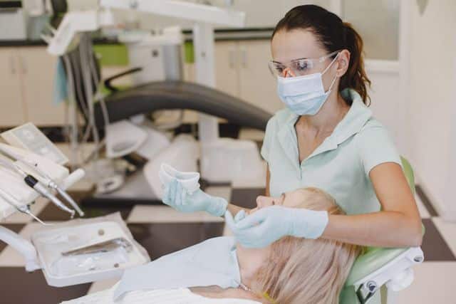hereth insurance consulting - is dental insurance worth it - Medical Worker Wearing Mask